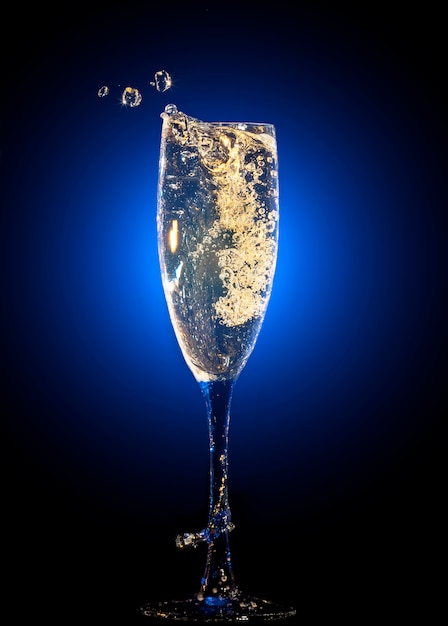 Glass of champagne with splashes