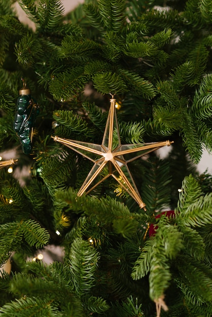 Glass Christmas toy star on the Christmas tree