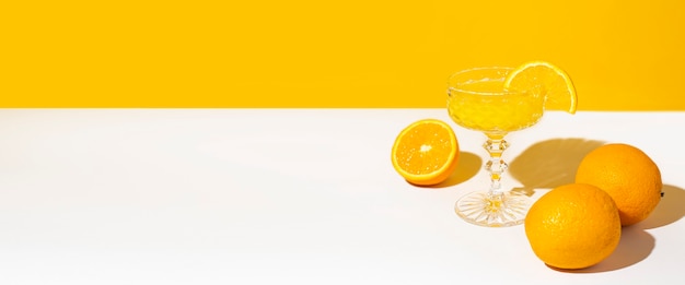 Glass of cocktail or orange juice in the sunlight.