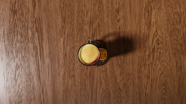 A glass of coffee on a dark wooden background Top view