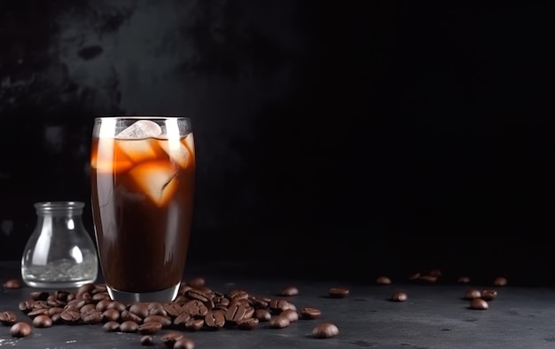 A glass of coffee with a dark background and a few coffee beans on the table.