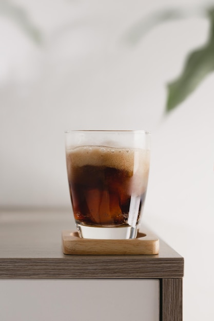 The glass of cola with ice