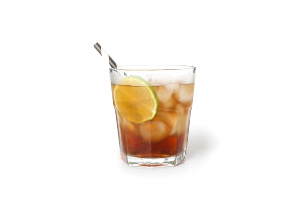 Glass of cold cola with lime isolated on white background