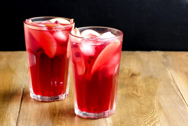 Glass of Cold Winter Drink With Fresh Cranberry and Apple Cold Horizontal Photo Wooden Background