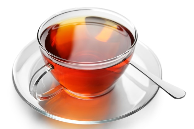 Glass cup of tea isolated on white surface