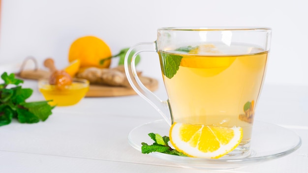 Glass cup with tea mint and lemon