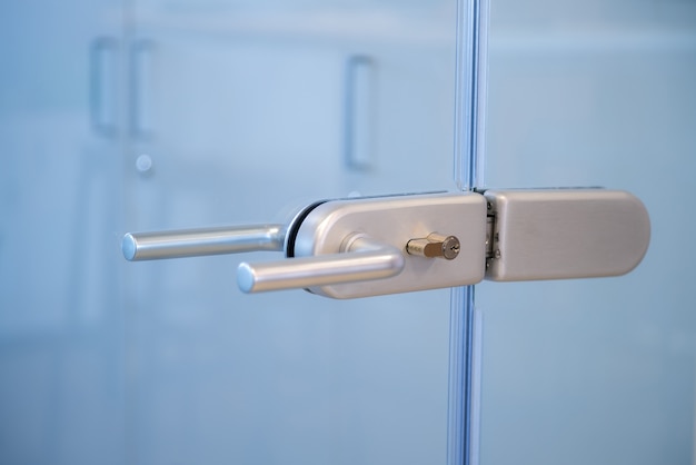 Glass door lock handle in the business office.