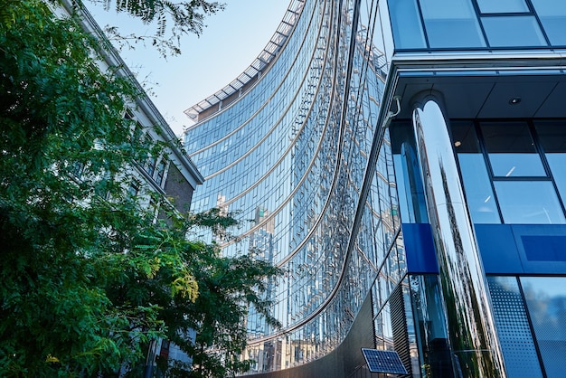 Glass facade of high rise building with geometric lines Modern architecture