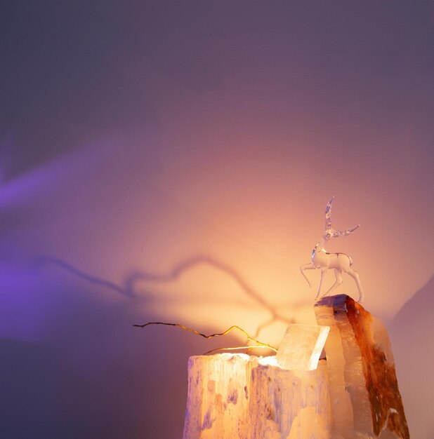 glass figurine of a deer on a light background