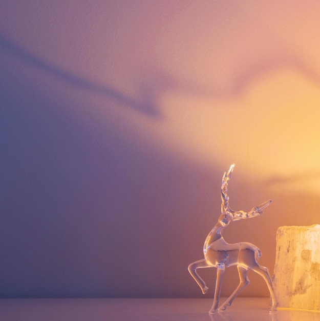 glass figurine of a deer on a light background