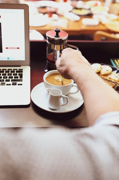 Glass of filter coffee with delicious cookies