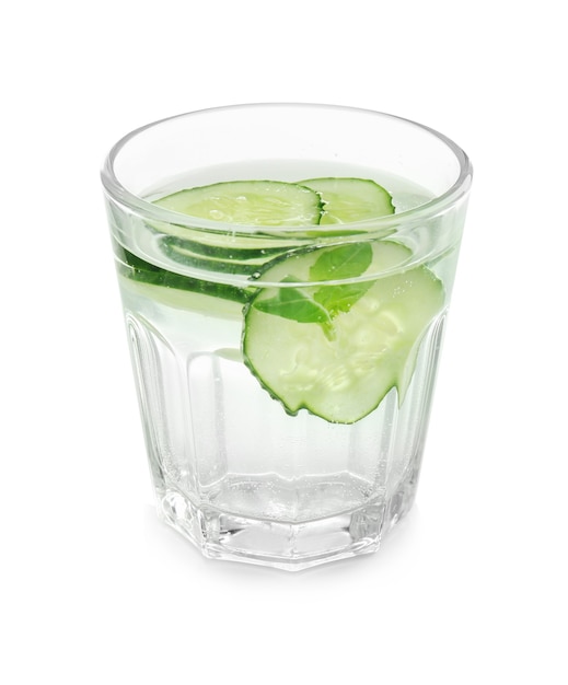 Glass of fresh cucumber water on white surface