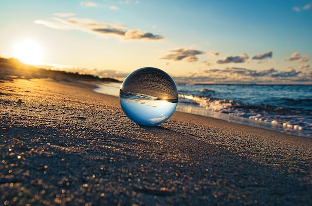 Glass globe on the beach of the Baltic Sea in Zingst in which the landscape is depicted