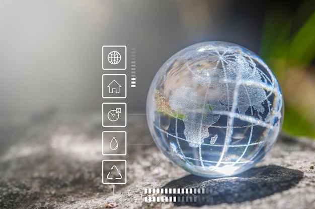 Photo glass globe in green forest with the icon environment of esg co2 and net zerotechnology environment society and governance for sustainable environment concept