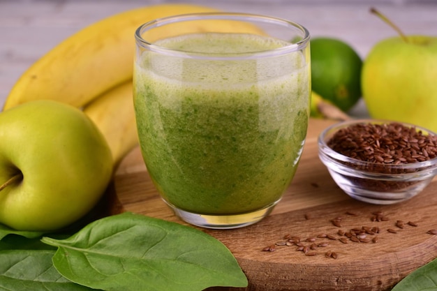 A glass of green healthy smoothieCloseup