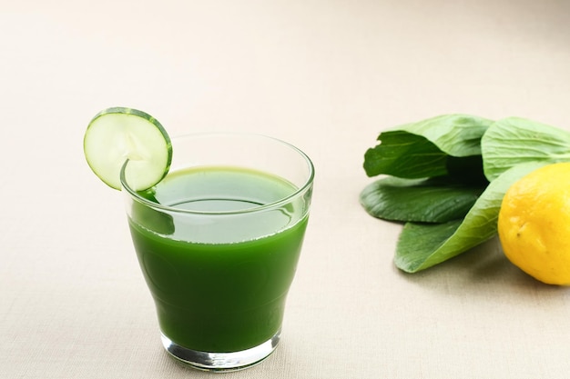 A glass of Green Juice, made from organic pakcoy, cucumber and lemon, very good for health.