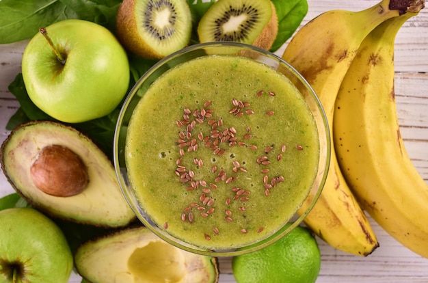 A glass of healthy green smoothie with flax seeds Closeup Flat lay