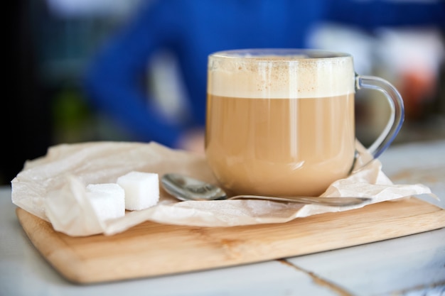 Glass of hot Latte coffee on the bar