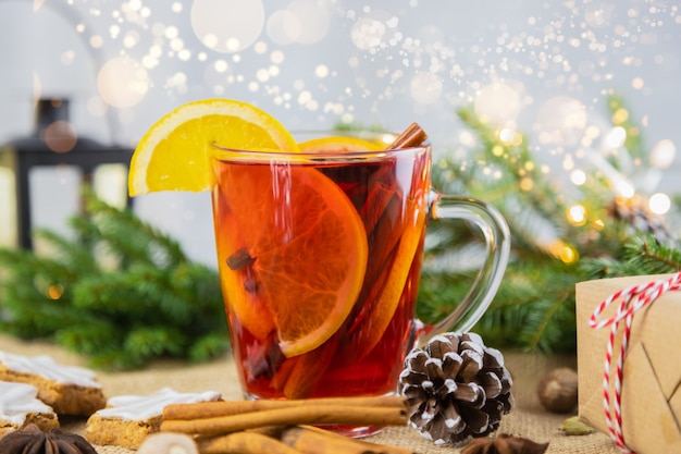 A glass of hot wine, mulled wine in a New Year's setting. Christmas, winter hot drink.