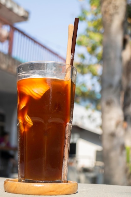 Glass of ice cubes and fresh coffee