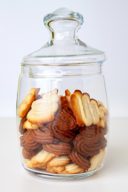 Glass jar filled with vanilla and chocolate cookies