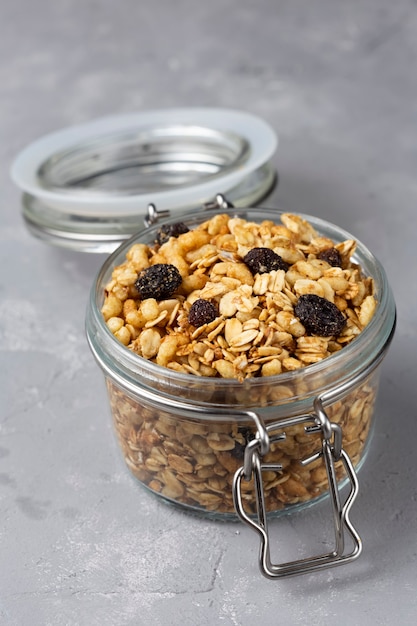 Glass jar with granola on the table