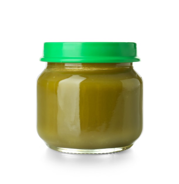 Glass jar with healthy baby food on white