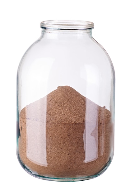 Glass jar with sand on white background