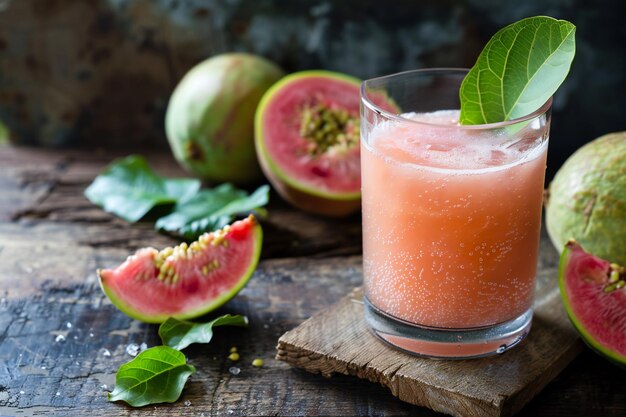 a glass of juice with a slice of watermelon and a half full of fruit