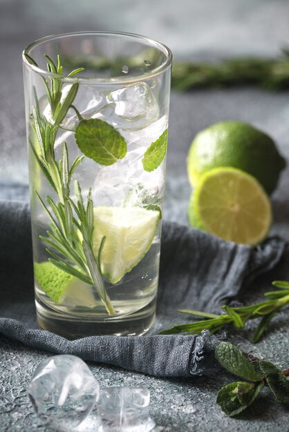 Glass of lime water with herbs