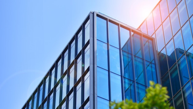 Glass modern building with blue sky background View and architecture details Urban abstract