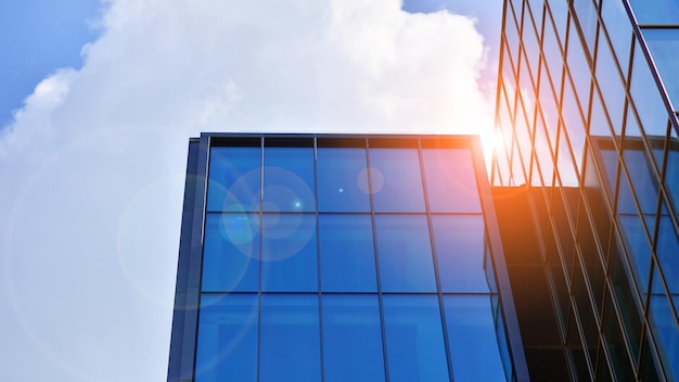 Glass modern building with blue sky background View and architecture details Urban abstract