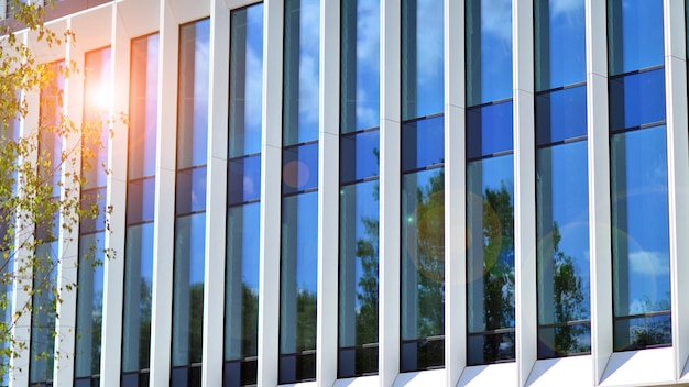 Glass modern building with blue sky background View and architecture details Urban abstract