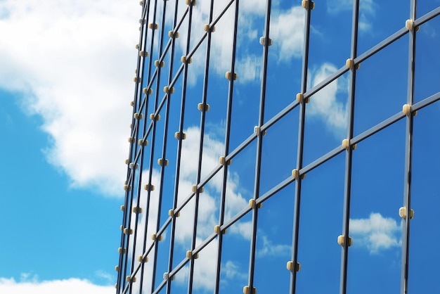 Glass office building reflection sky cloud