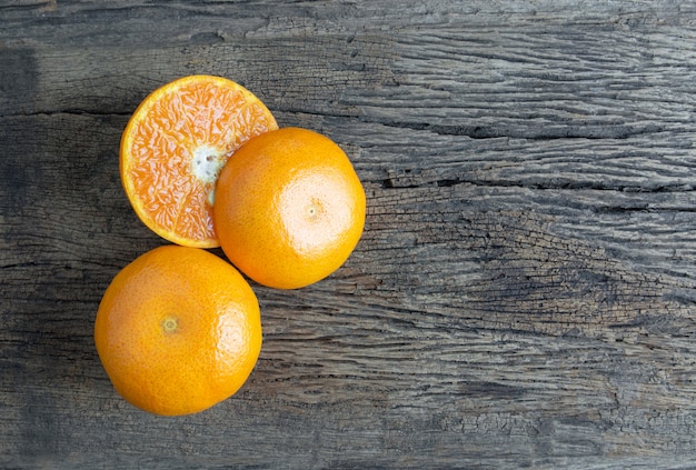 Glass of orange juice from above on wood table