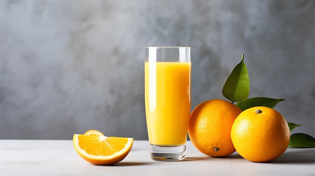 A glass of orange juice next to oranges