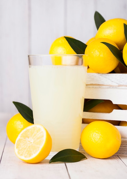 Glass of organic fresh lemon juice with fruits