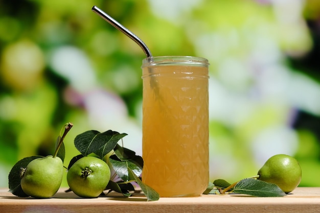 Glass of pear juice outdoors