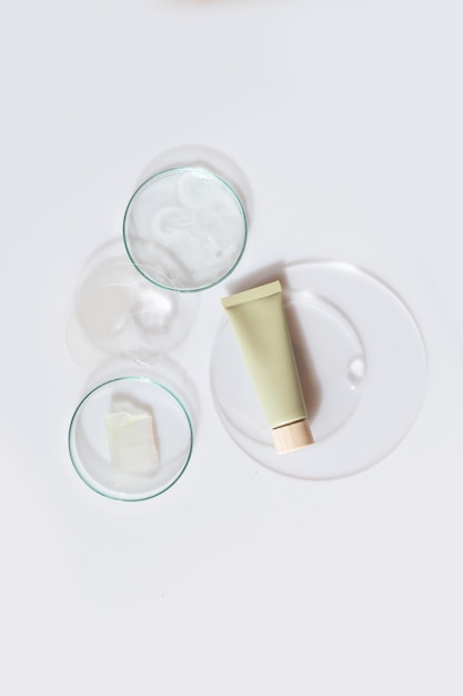 Glass petri dish with transparent pure serum for skin care