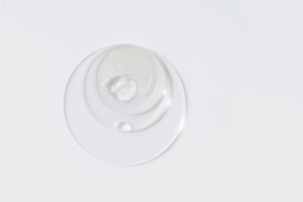 Glass petri dish with transparent pure serum for skin care