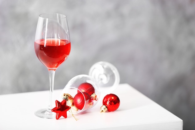 Glass of red wine with christmas accessories