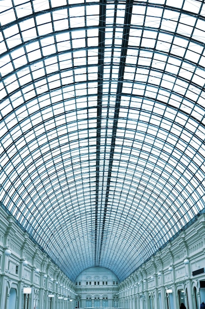 A glass roof of a building with a blue roof and the word " the word " on it. "