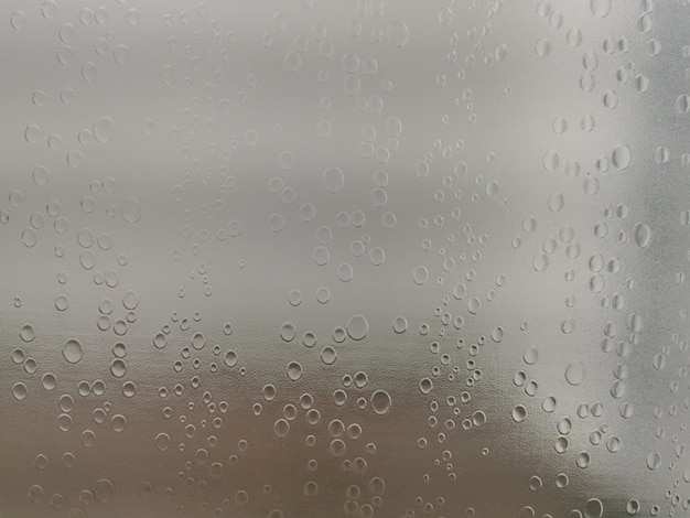 Glass shower screens and reflections. Water drops pattern surface pattern.