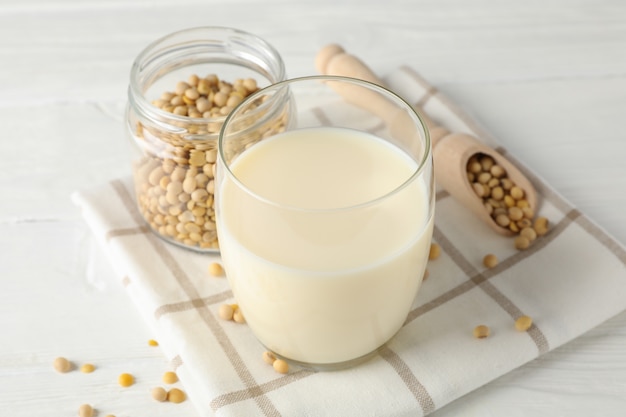 Glass of soy milk, soybeats seeds. Closeup