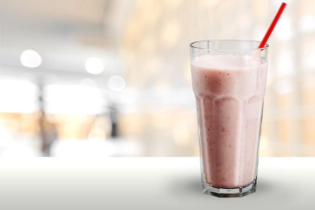 Glass of strawberry smoothie isolated on  background