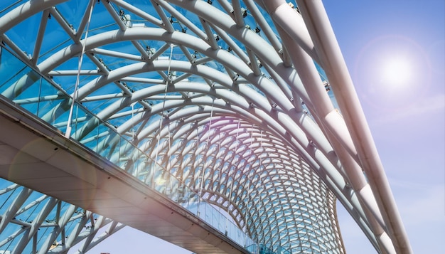 Glass transparent bridge of an unusual shape from an unusual angle