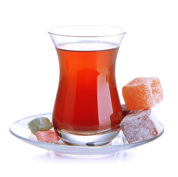 Glass of Turkish tea and rahat Delight isolated on white