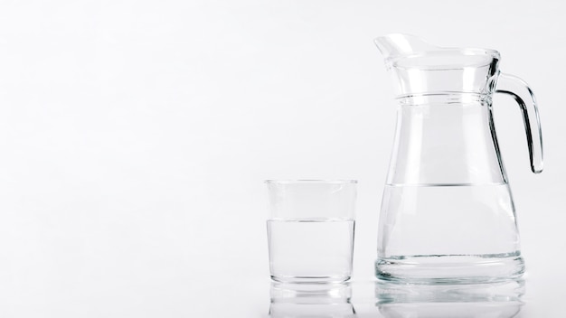 Glass of water next to jar