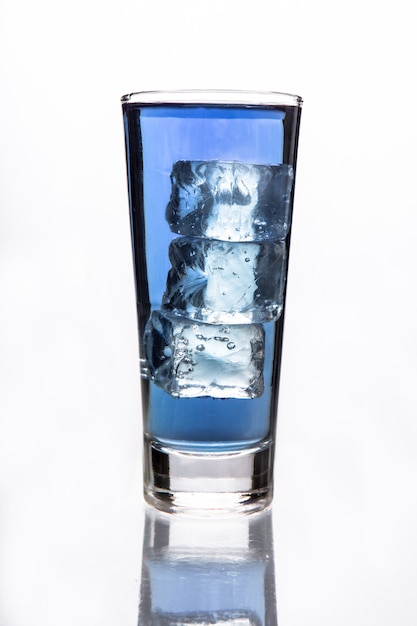 Glass of water with three ice cubes