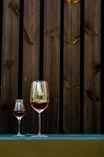 A glass of white wine Minimalism Glass with wine and berries flowers A glass of water